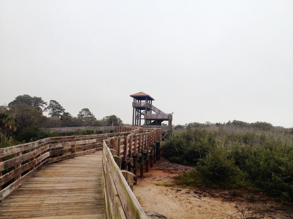 view of a cloudy beach boardwalk in florida