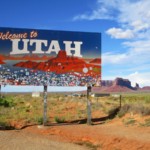 utah welcome sign along highway on sunny day