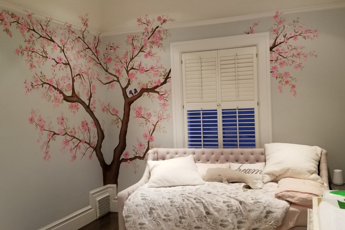 A tree mural in a bedroom