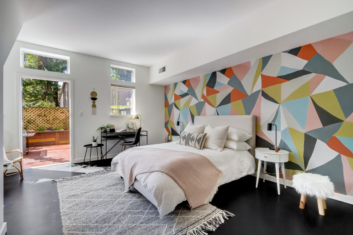 A geometric mural in a bedroom