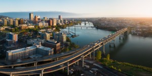 People Leaving Seattle for Portland city skyline with bridge