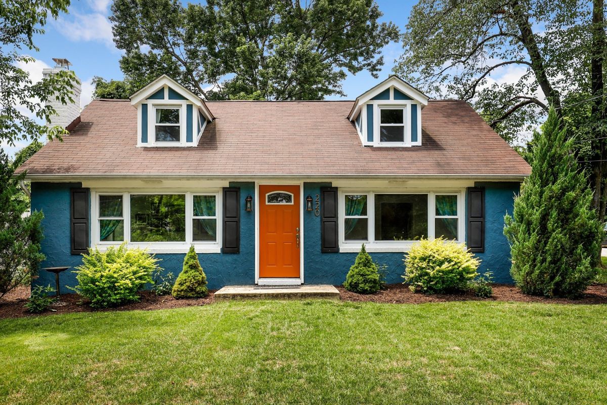 blue house with an orange front door