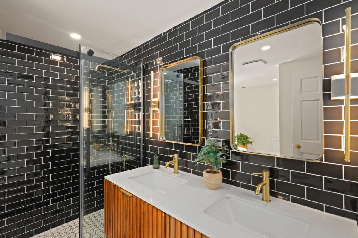 A black tiled bathroom