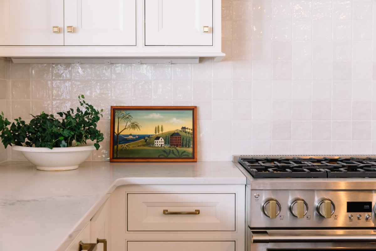 A kitchen with Zellige tile