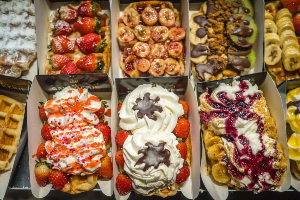 belgian waffles with toppings like fruit and whipped cream