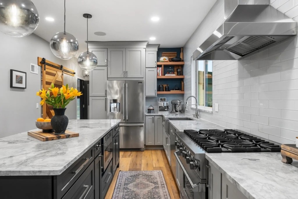 grey kitchen with stainless steel appliances
