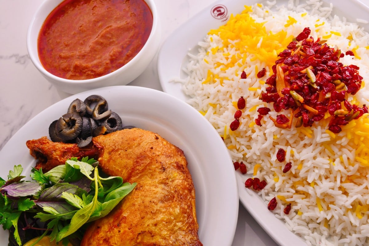 persian food on a table with pomegranate rice