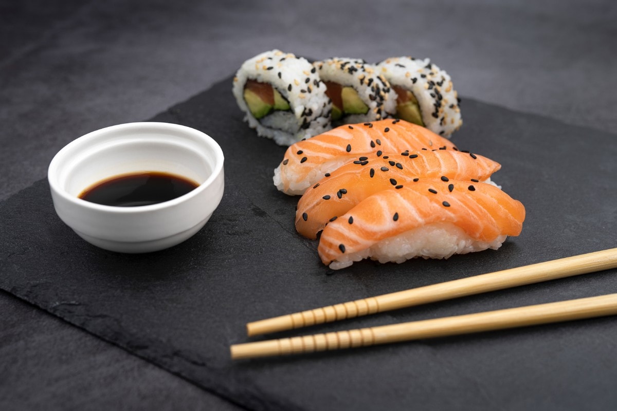 salmon sushi chopsticks and soy sauce