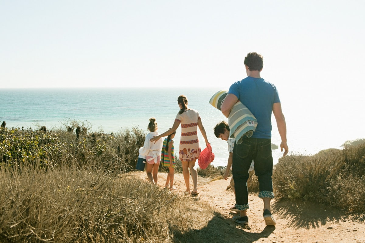 family walking to the beach in los angeles _ getty