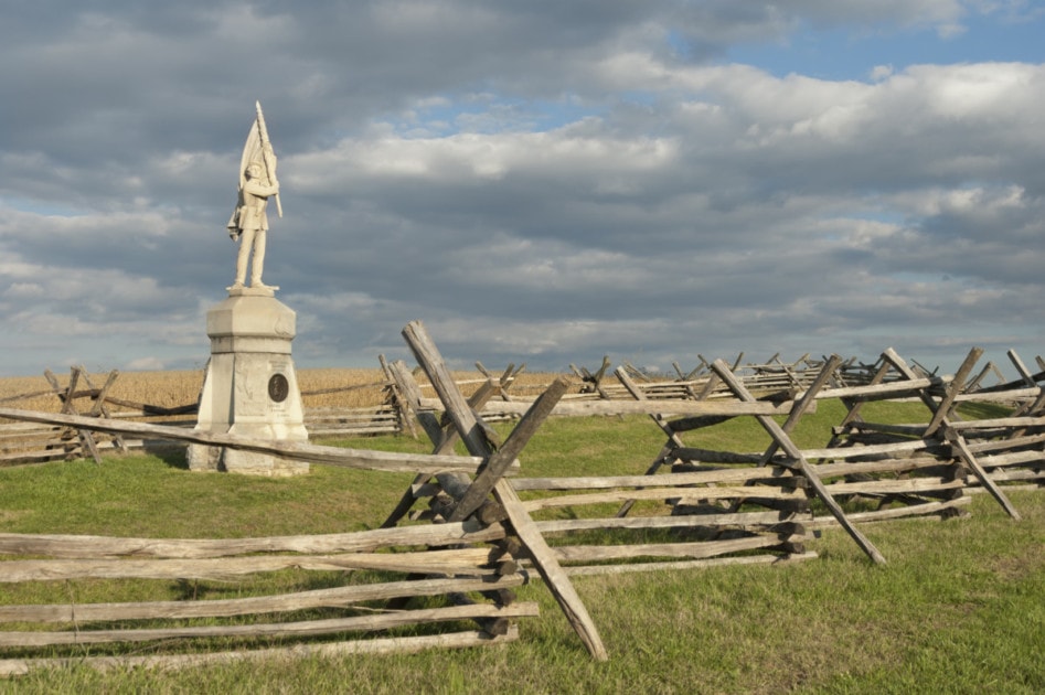 Antietam National Military Park, Sunken Road and Bloody Lane fence line and Union soldier monument, Sharpsburg, MD, USA.