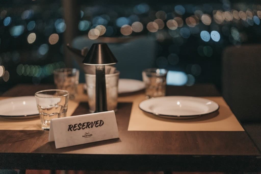 White sign to reserve a table at a restaurant