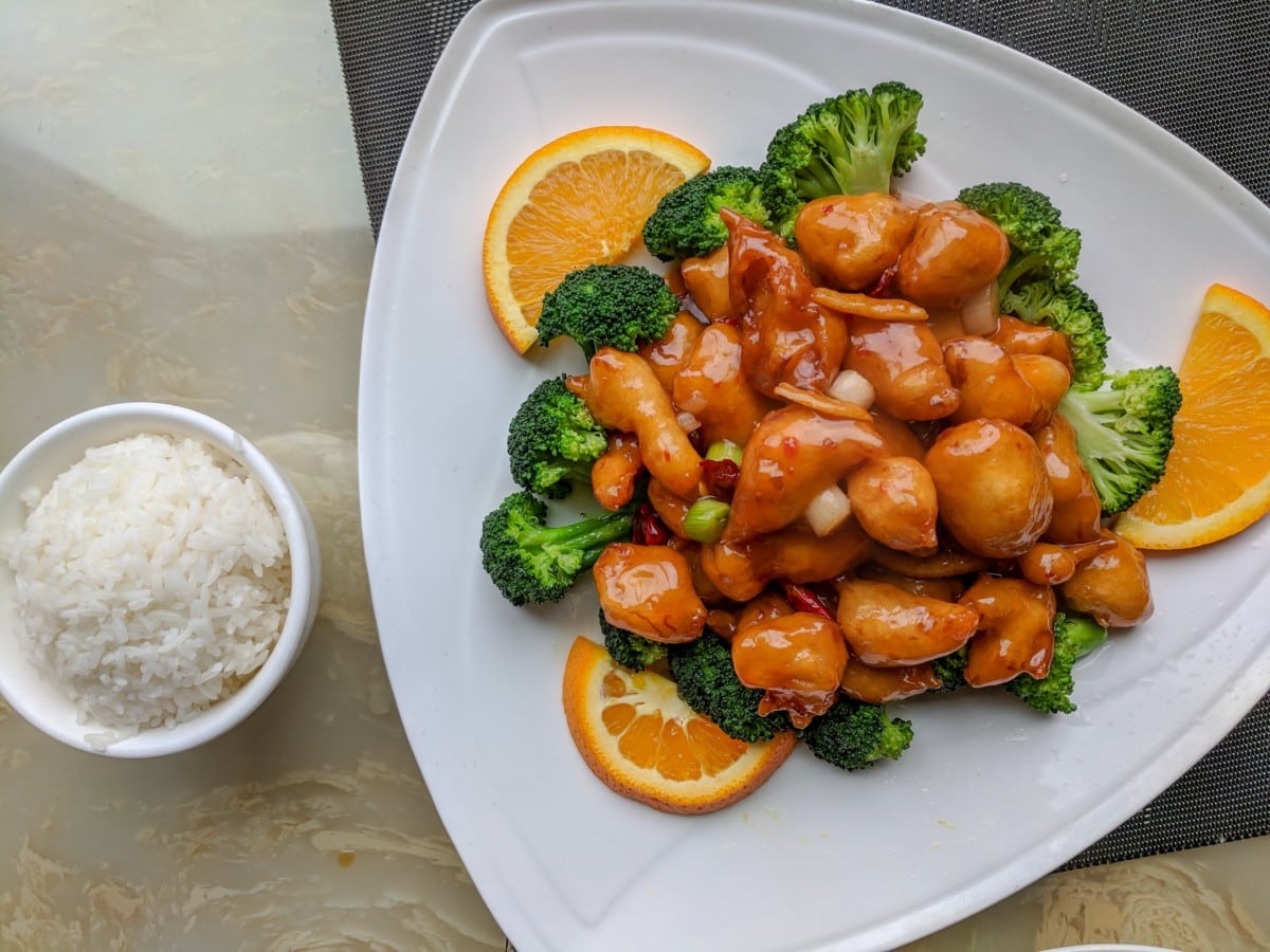 orange chicken with broccoli and rice