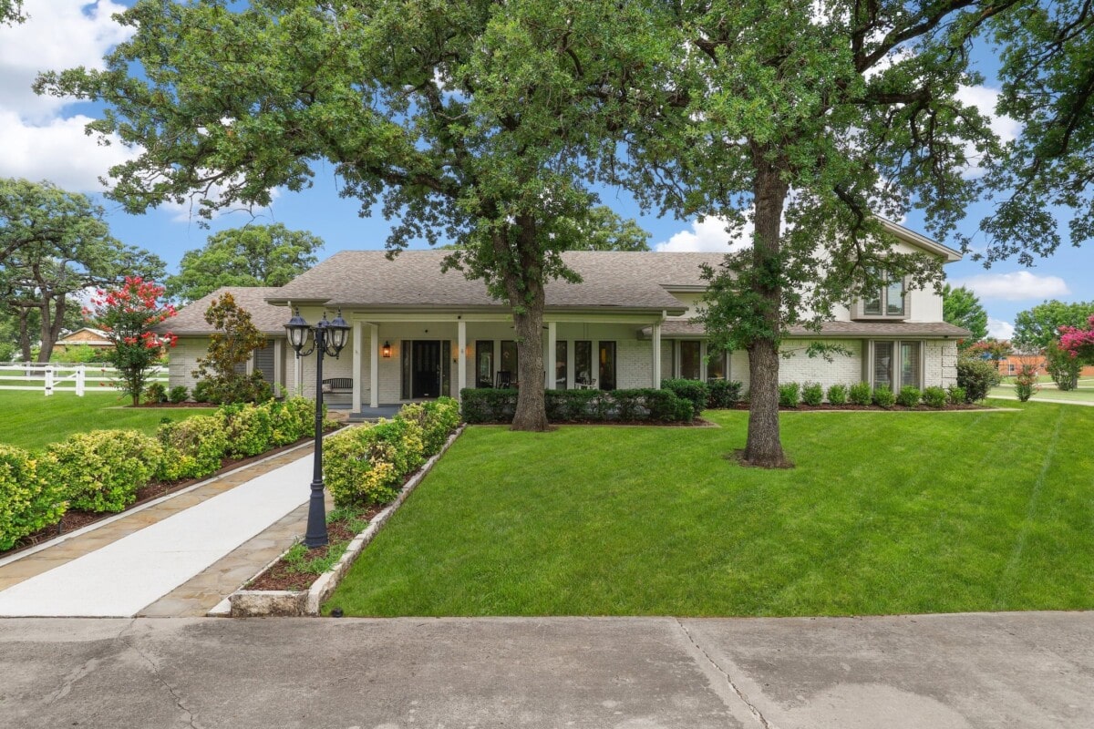 curb appeal manicured front lawn lush trees