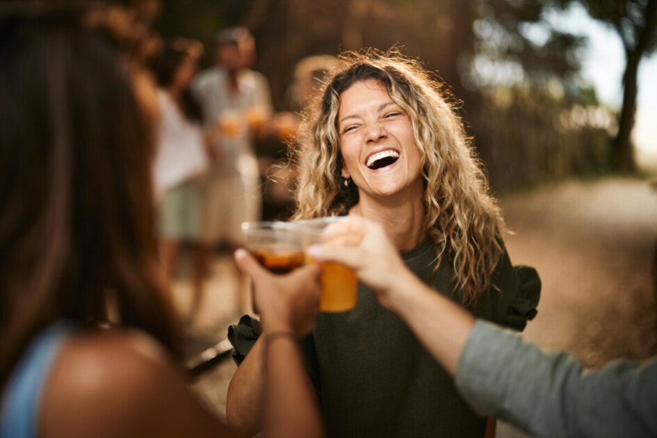 Woman toasting with her friends at a brewery
