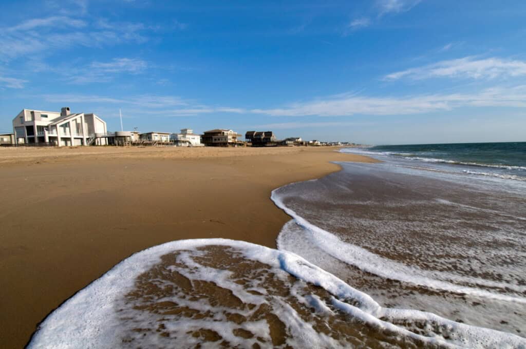 Beach front houses standing on Virginia Beach by the Atlantic Ocean