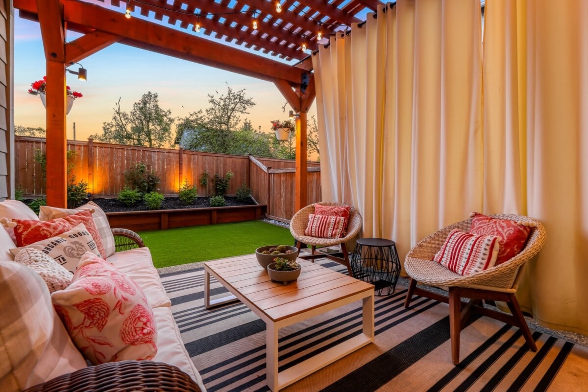 remodeled backyard patio with furnishings and curtains in san jose