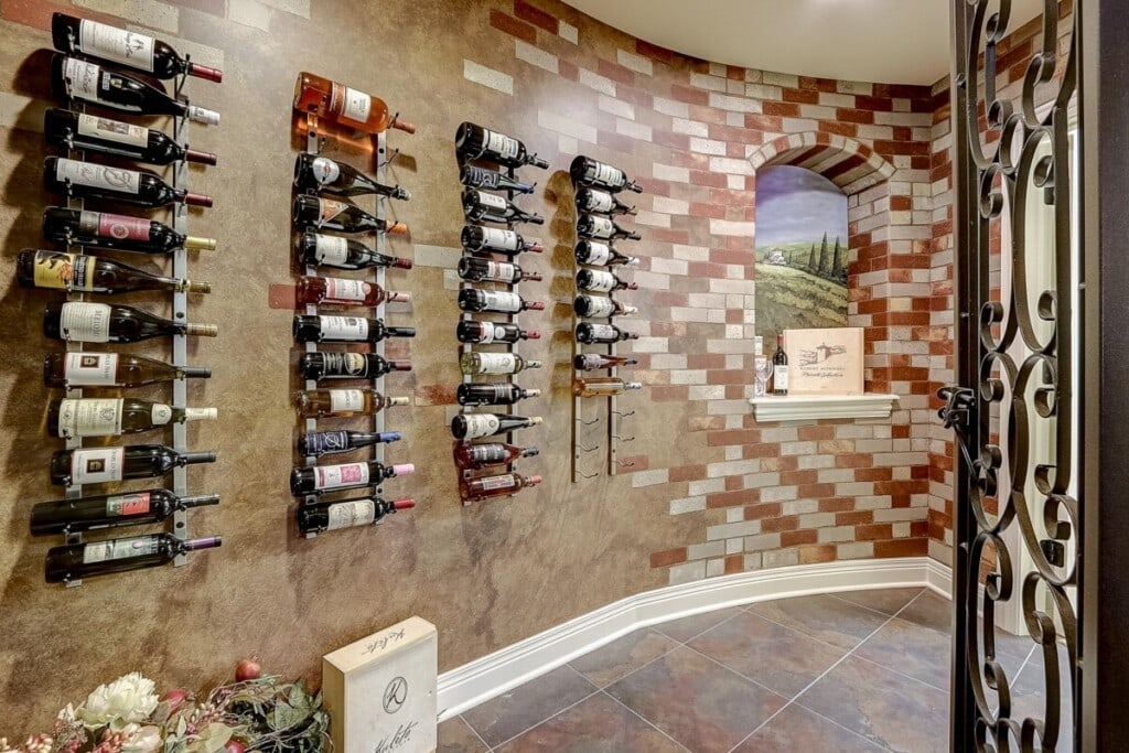 wine room in a home with bottles on the wall