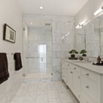sleek marble bathroom with step-in shower