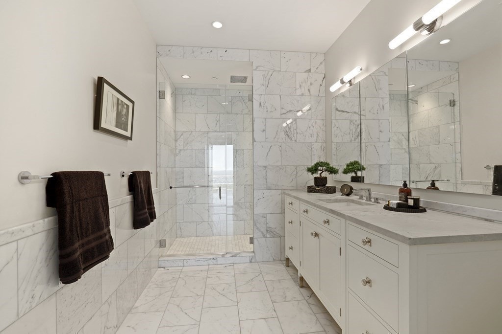 sleek marble bathroom with step-in shower