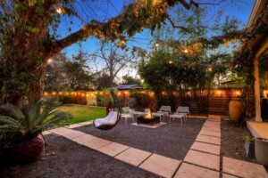 backyard oasis with seating at dusk
