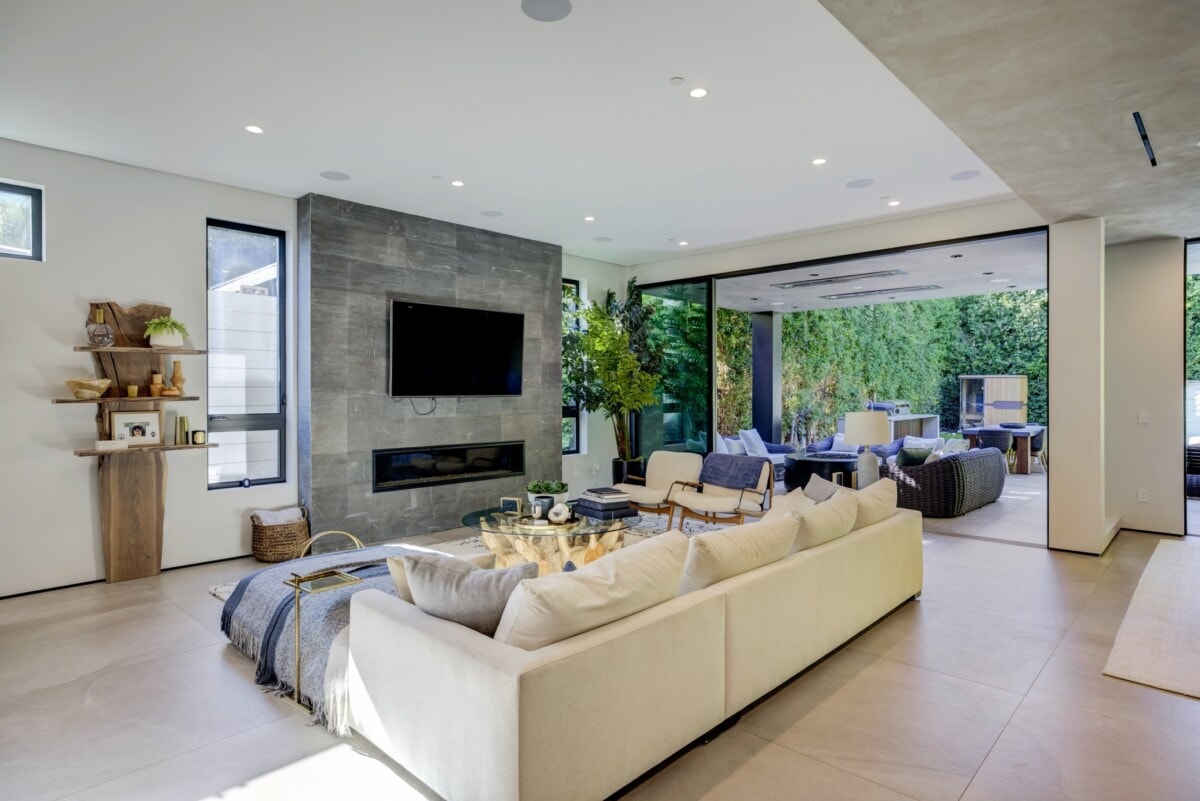 open concept living room sleek fireplace