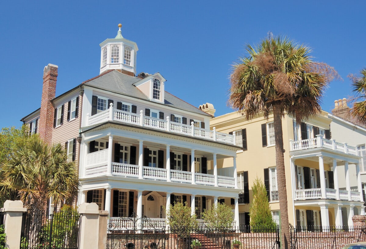 Southern style house with large front porches and palm trees in historic Charleston, SC