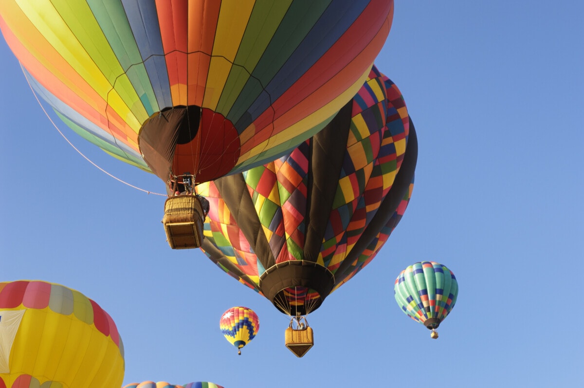 Colorful hot air balloons rising into the sky