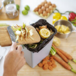 Reclycling vegetables peels in a garbage bin