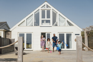 family walking outdoors at beach house