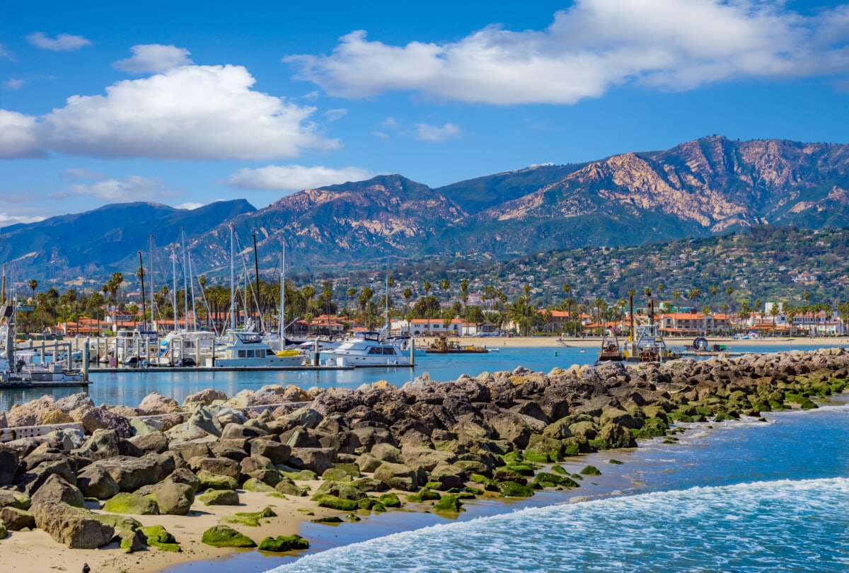 Santa Barbara Marina shoreline breakwater with recreational boats, CA