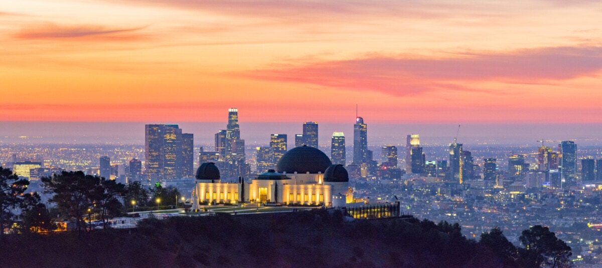 Los Angeles skyline at dawn with Griffith Park Observatory in the foreground _ getty