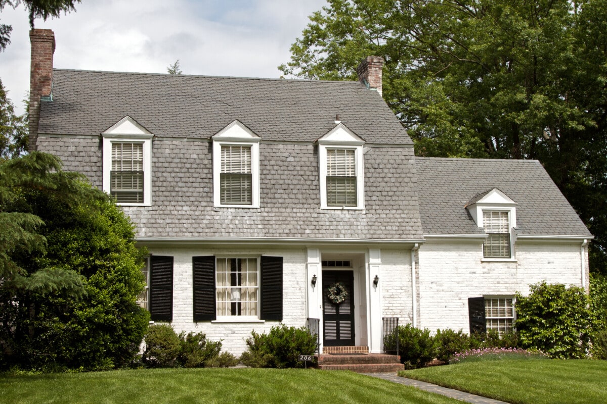 colonial style home with black details_Getty
