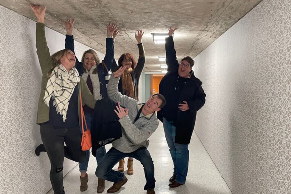 group posing in an underground tunnel in houston