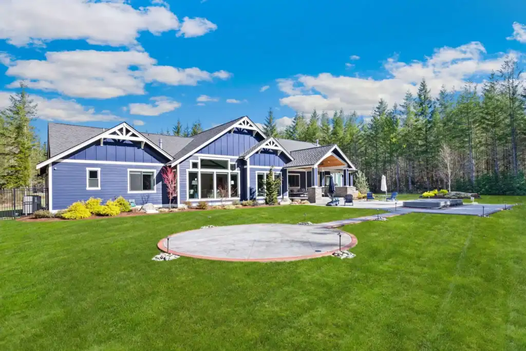 large backyard blue house