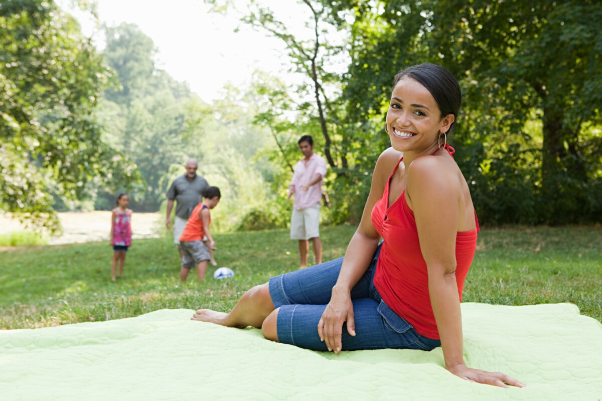 Adult woman on blanket in park