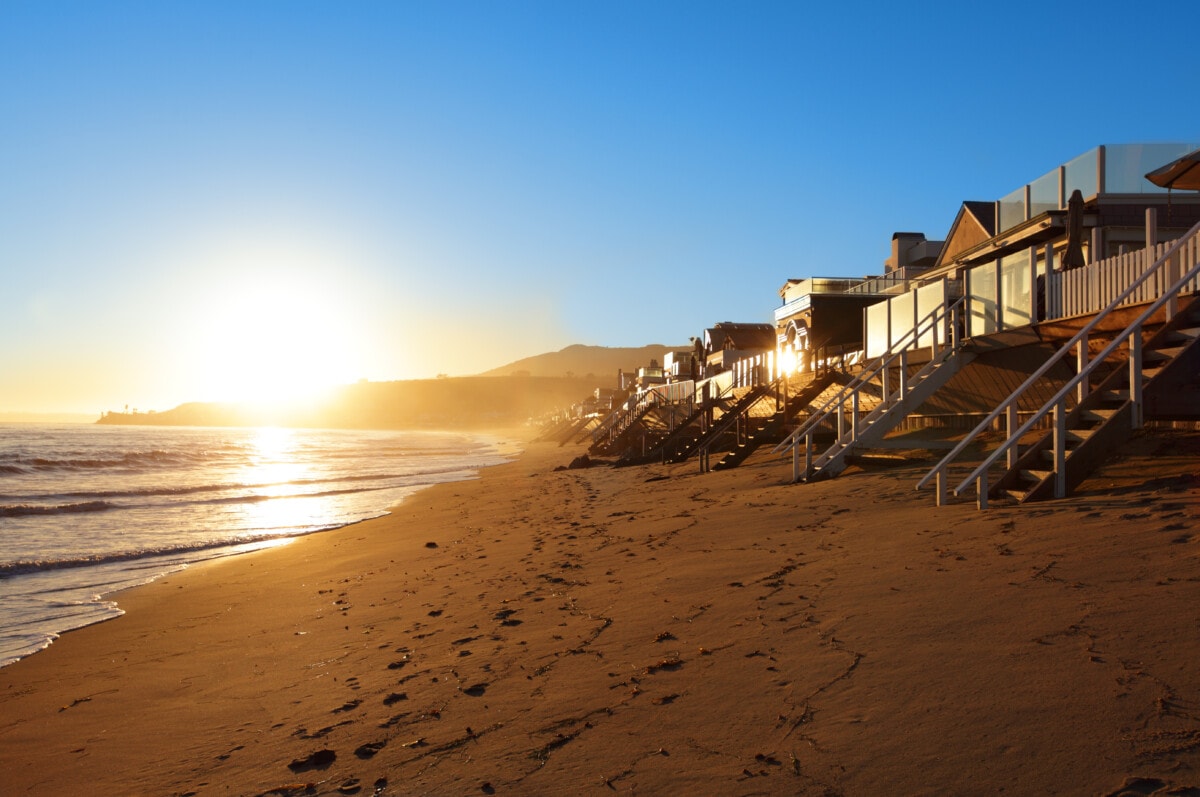 Houses on private Malibu beach during sunset