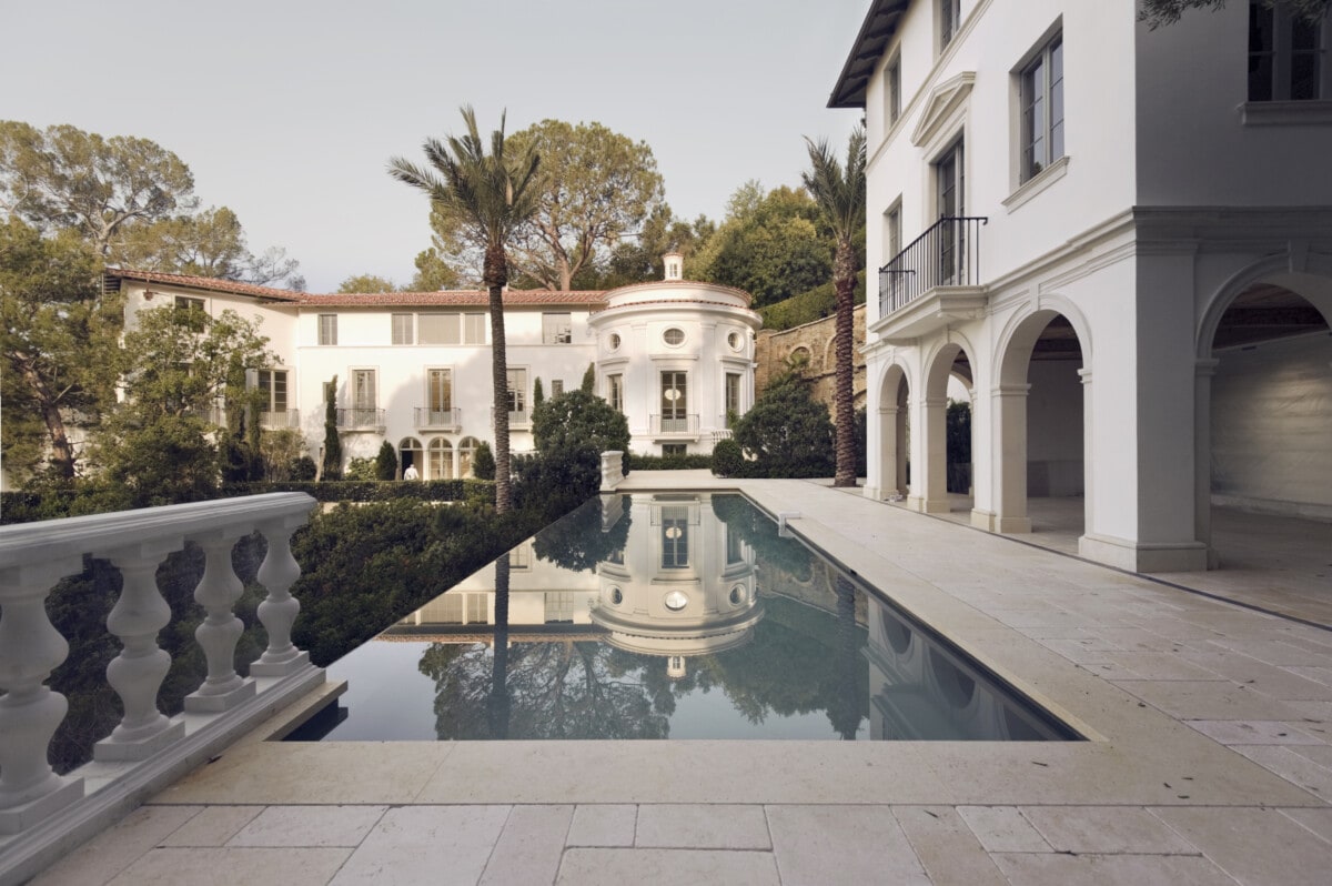 Exterior photo of a Bel Air mansion featuring a pool