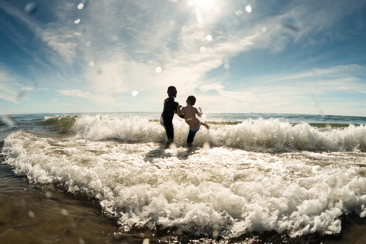 kids playing in the ocean