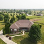 large brown home on land in kentucky