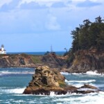 coos bay rock and wooded area with ocean waves
