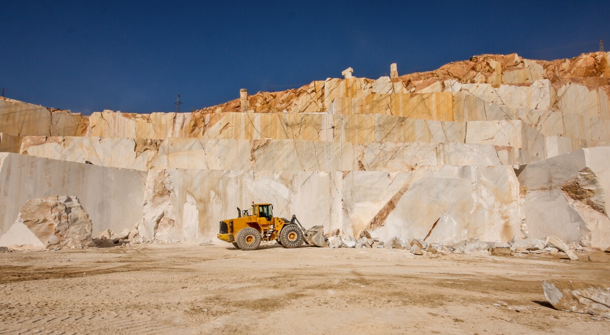 Marble quarry with a yellow tractor
