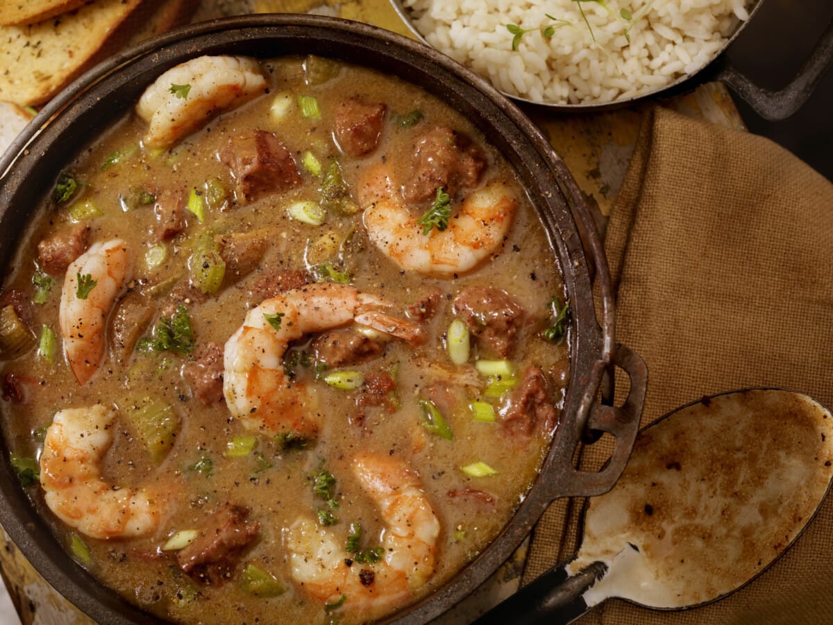 Creole Style Shrimp and Sausage Gumbo in a cast iron pot with White Rice and French Bread.