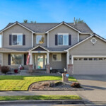 two story home in puyallup with large front yars