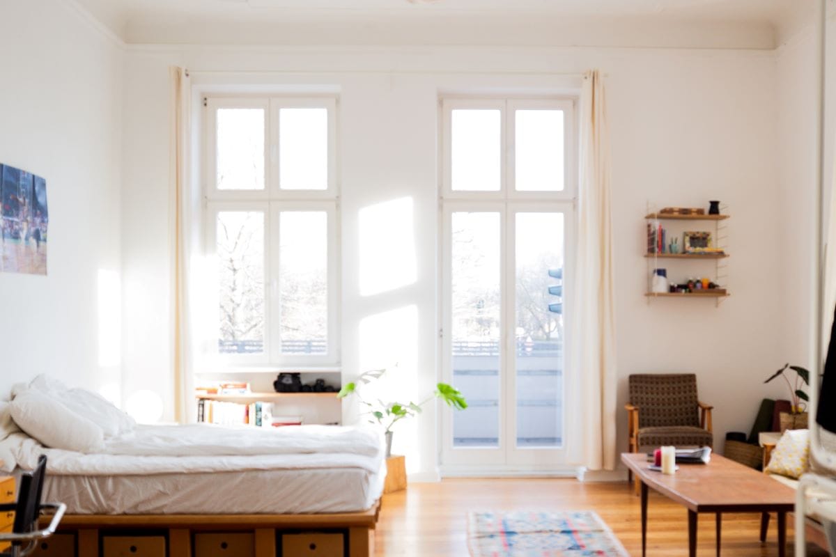 studio apartment bed and windows