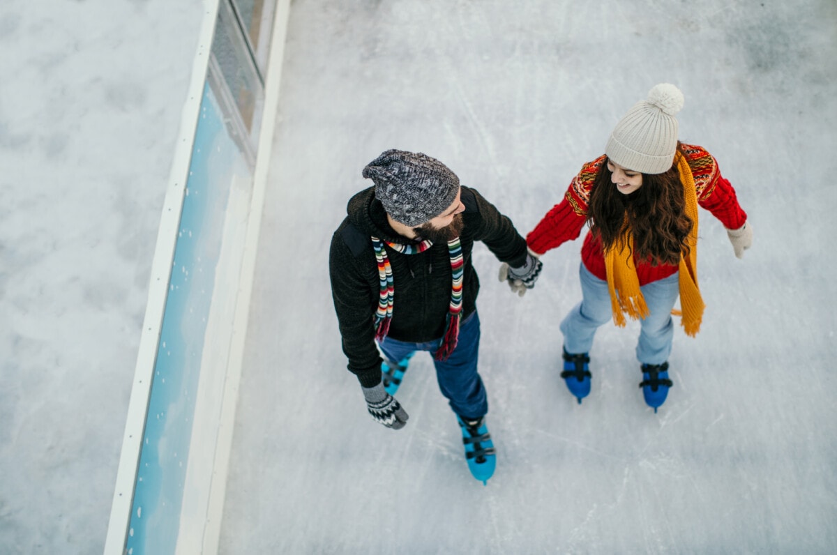 Couple skating during winter season