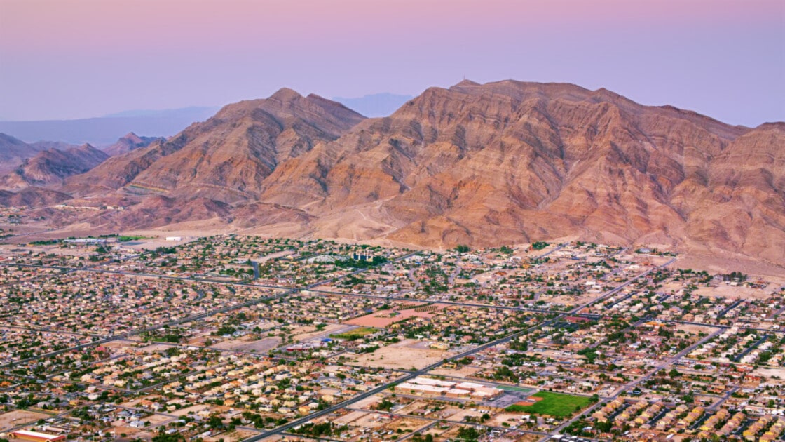 Aerial view of neighbourhood in Las Vegas beneath Frenchman Mountain, Nevada, USA.