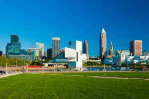 Cleveland downtown skyline with a waterfront and park in the foreground.