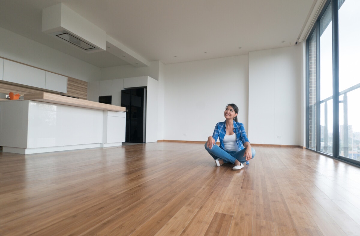 Women sitting in an empty apartment