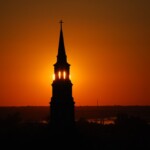 A church steeple at sunset