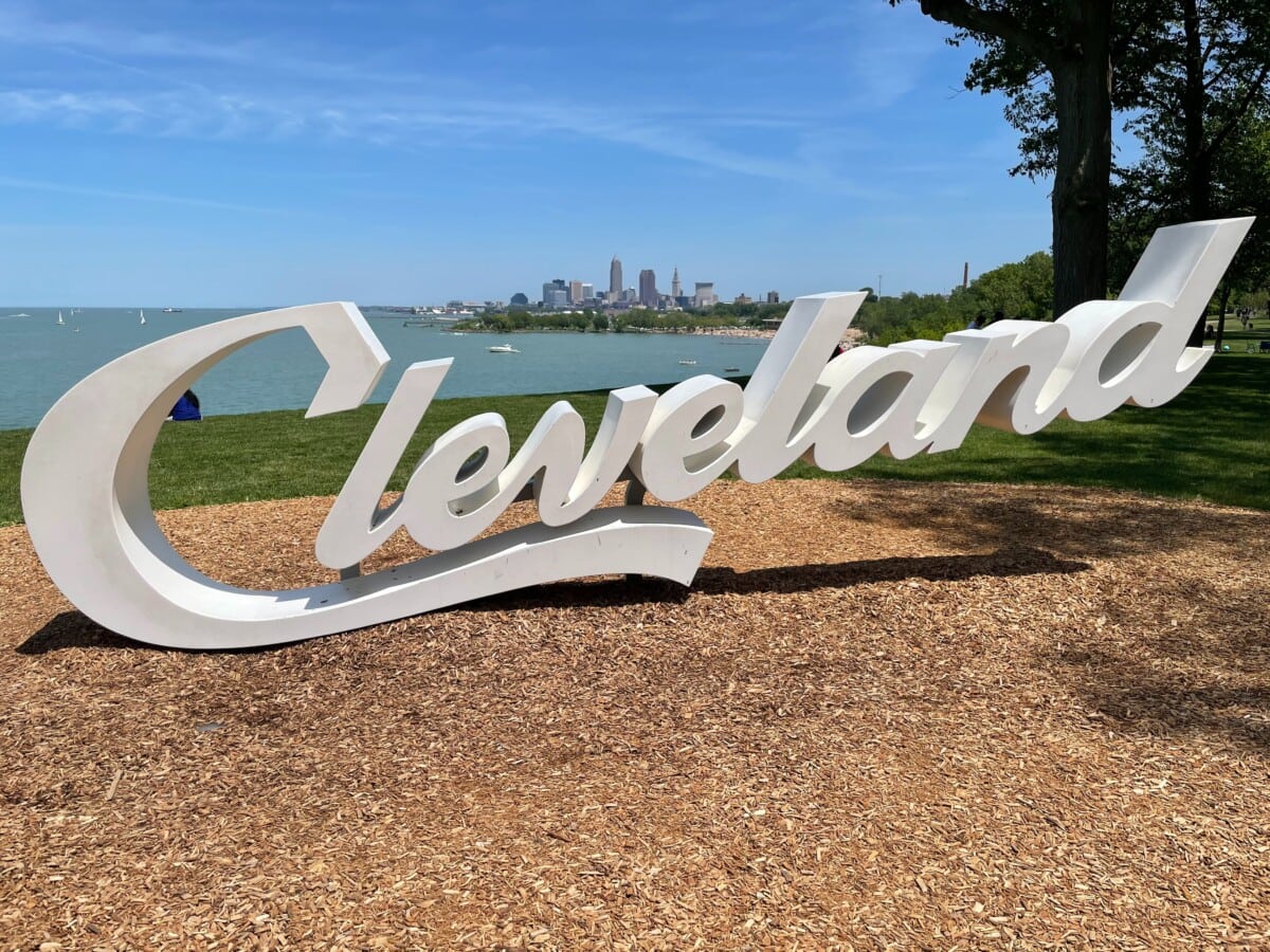 Cleveland ohio sign in white with city in background
